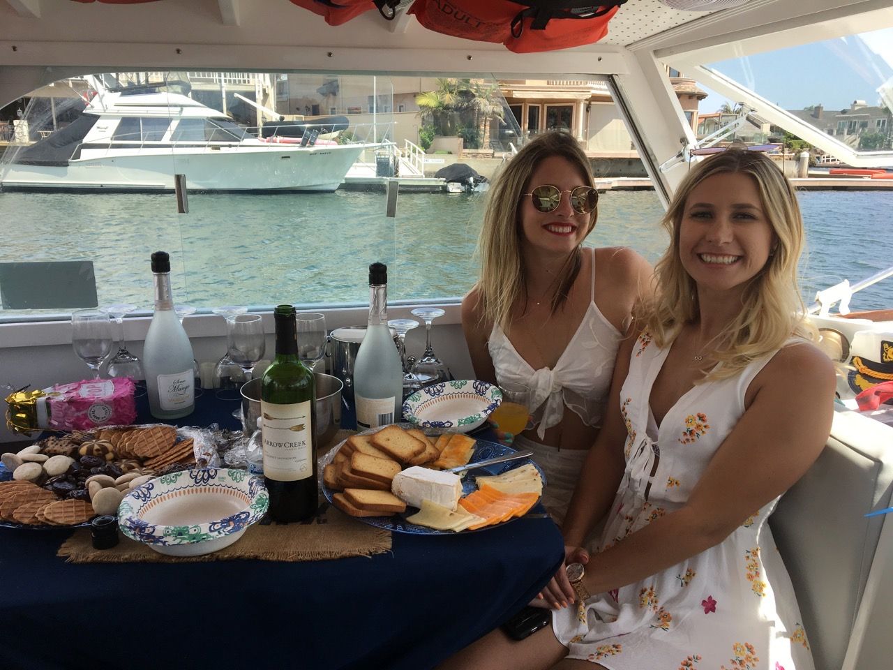 Girls trip aboard classic wooden boat in Huntington Harbour, CA