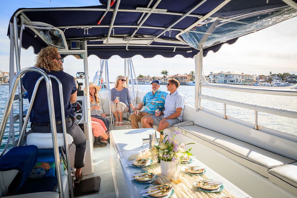 Guests seated at a table aboard Charly More