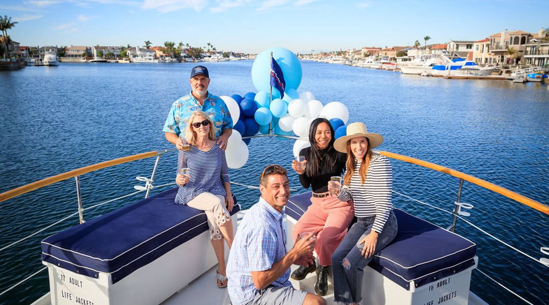A small group toasting a corporate outing in Huntington Harbour