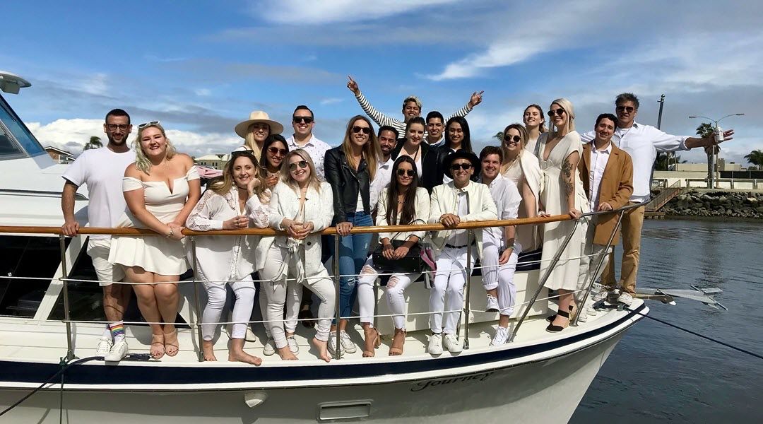 A large group celebration aboard Journey
