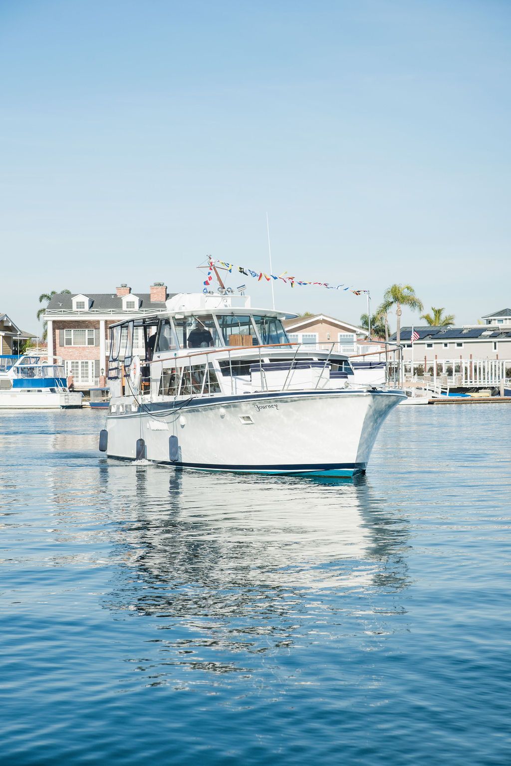 Luxury yacht crossing Huntington Harbour in Huntington Beach, CA